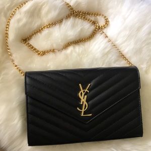 Yves Saint Lauren black crossbody large wallet.
